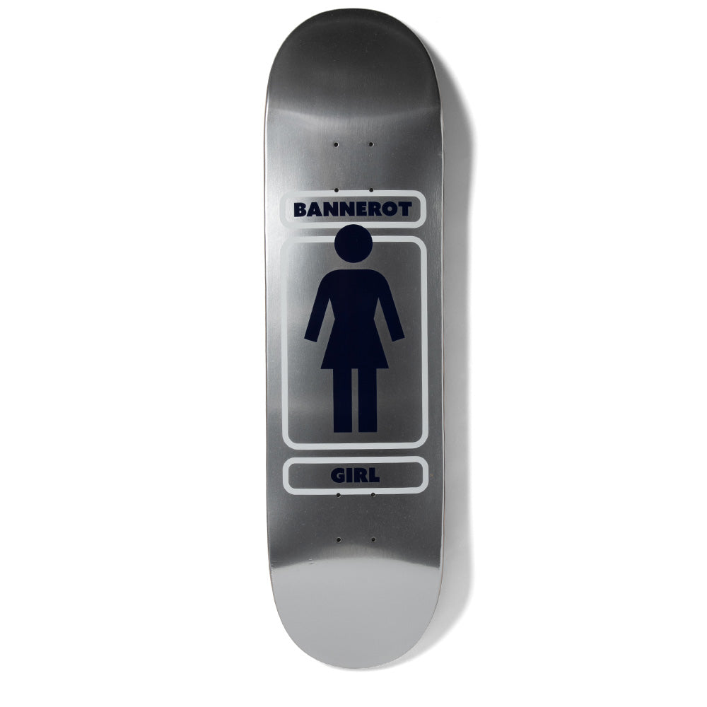 Girl Bannerot Metalls skateboard deck: Girl's logo figure in navy on a brushed silver metallic finish, inside a rounded white outlined frame with the rider name above and brand name below.
