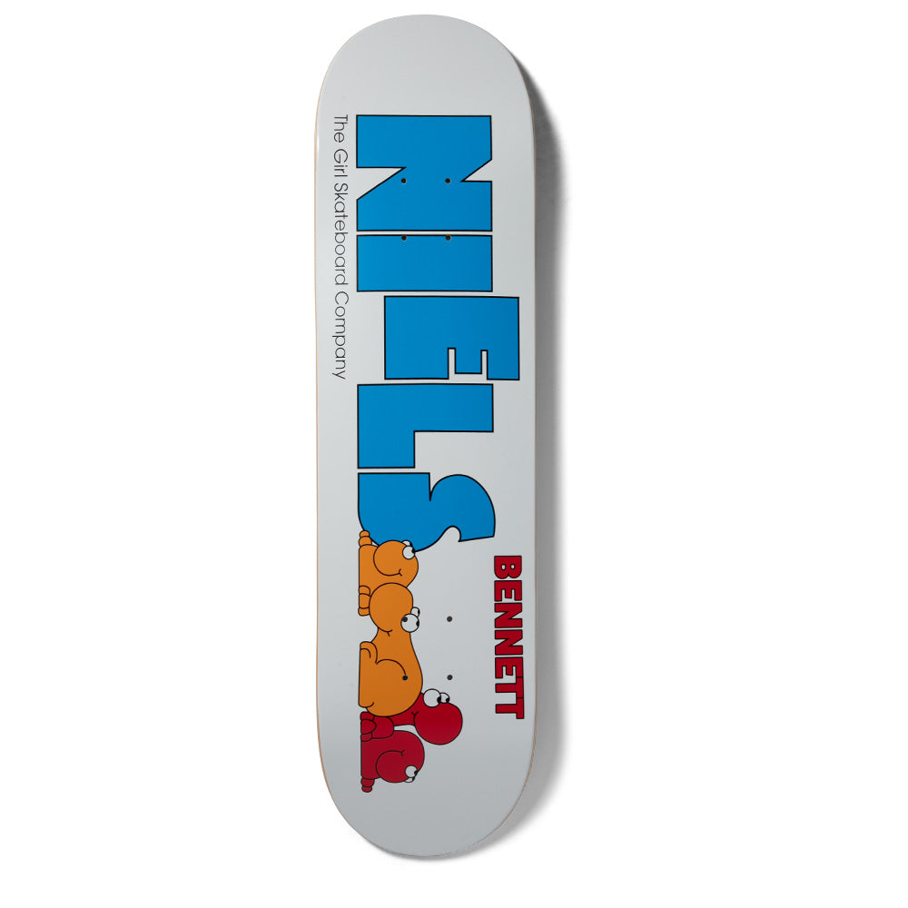 Girl Bennett Nerd Niels skateboard deck: Large blue block capitals spelling NIELS on a pale grey deck, ending in a line of small cartoon creatures in orange and red crawling below the S. Bennett in red lettering and the company name in small text.