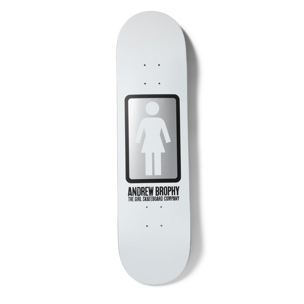 Girl Brophy OG Black & White skateboard deck: The Girl logo figure in a rounded black-bordered rectangle with a silver gradient, on an all-white deck, with the rider name and company line in black capitals beneath.