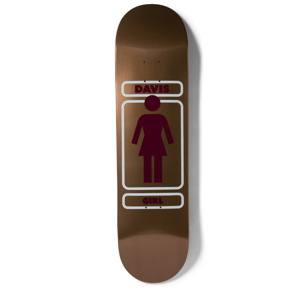 Girl Davis Metals skateboard deck: Girl's logo figure in maroon on a brushed copper-bronze metallic finish, inside a rounded white outlined frame with the rider name above and brand name below.