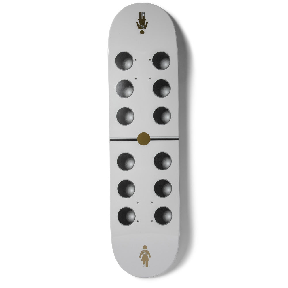 Girl Gass Goodlife skateboard deck: Pale grey deck styled as a domino, with six dark recessed-looking circles on each half divided by a thin black line and a gold centre dot. A small gold Girl logo sits at the tail and a gold figure icon at the nose.