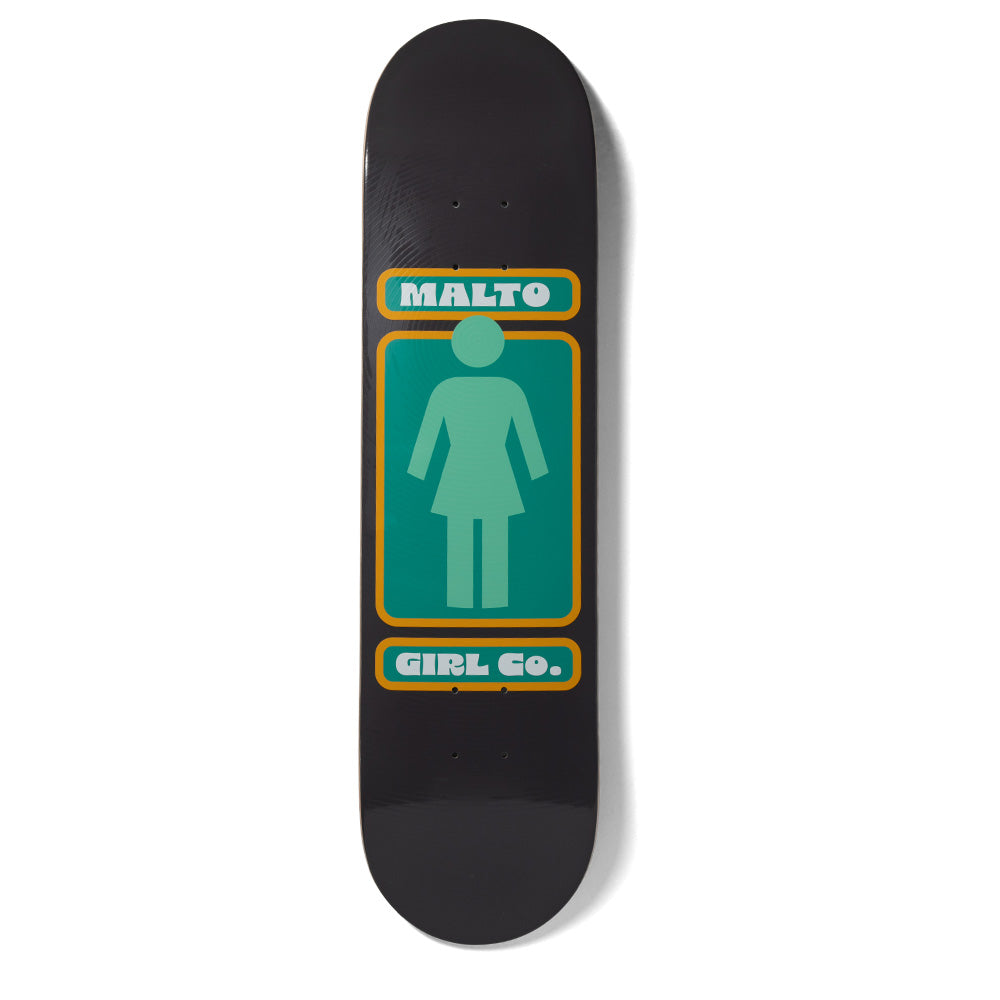 Girl Malto Hypno Girl skateboard deck: The Girl logo, a pale green female silhouette on a green panel, is framed by orange borders on a black deck. A rounded label above reads MALTO and another below reads GIRL Co., in a retro 1970s style.