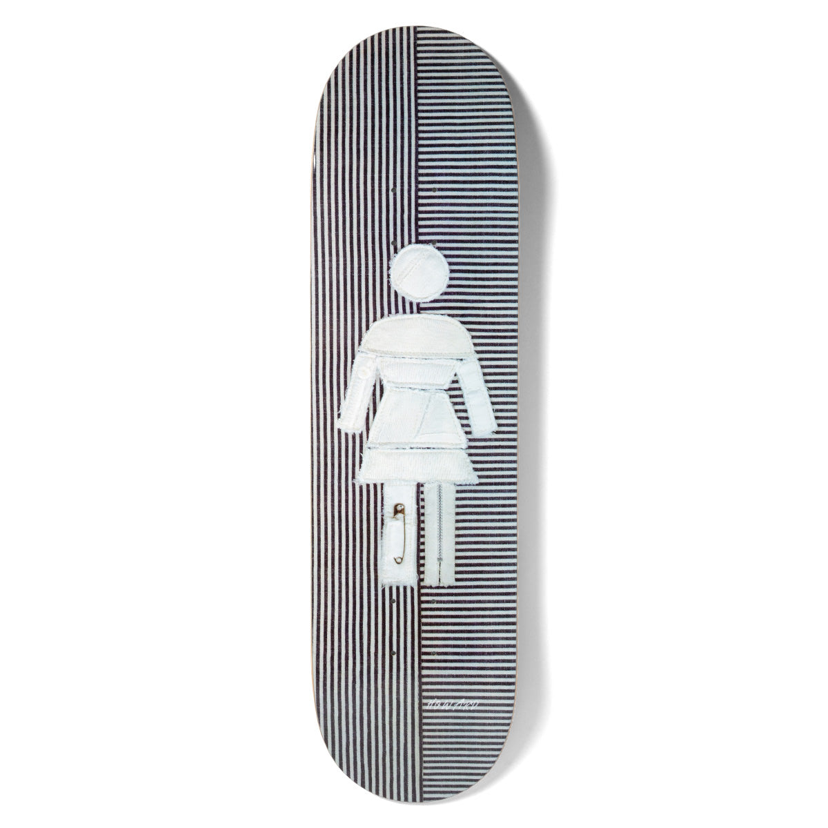 Girl Howard Scraps skateboard deck: Girl logo figure made from patched pale denim scraps with a safety pin and zip, set against split black and white vertical pinstripes.