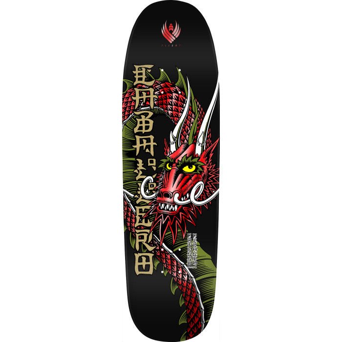 Powell Peralta Caballero Ban This Black Red Foil Flight skateboard deck: A red scaled dragon with yellow eyes, white horns and green frills coils down a black deck. Gold Japanese-style characters run vertically beside it, with a small red winged emblem at the top.