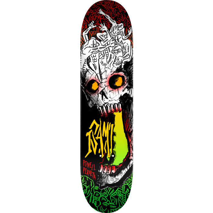 Powell Peralta Isamu Yamamoto Skull skateboard deck: A hand-drawn skull with glowing orange eyes and a wide open mouth with a yellow-green tongue, topped by a pile of tangled white figures. Black, red and green patterned borders frame it, with a tag-style signature in yellow.