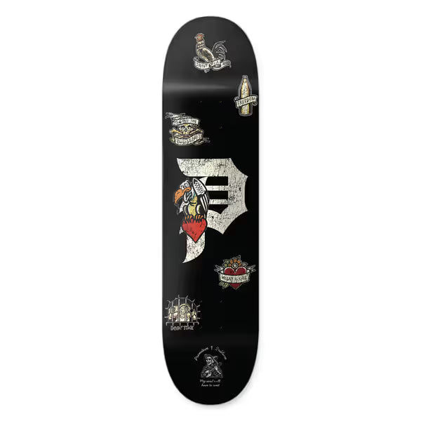 Primitive x Sublime Freedom skateboard deck: A black deck with the Primitive 'P' logo in distressed cream, surrounded by small tattoo-flash-style images including a rooster, an eagle on a heart, a bottle, a skull and a barred cell, plus a reaper at the base.