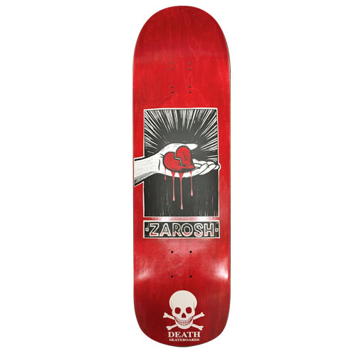 Death Skateboards Death Zarosh Heart 9 Pool skateboard deck: Black and white panel of a hand holding a broken, dripping red heart against radiating lines, above a name plate, on red stain. Skull and crossbones logo at the tail.