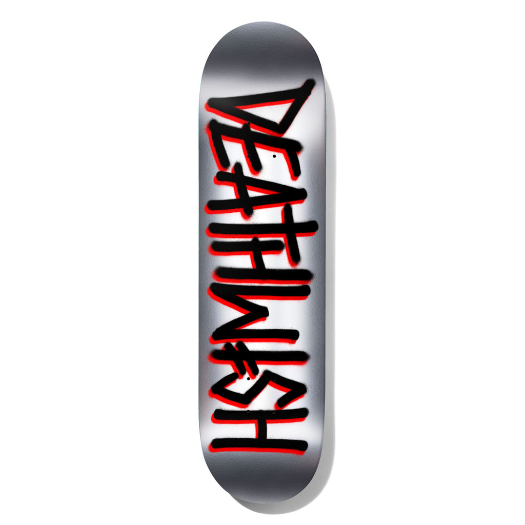 Deathwish Deathspray Foil Black/Silver 8.25 skateboard deck: Silver foil deck with the Deathwish name sprayed vertically in black graffiti-style letters with red outlines and drips.