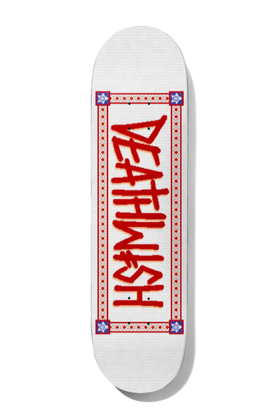 Deathwish Deathspray Knitted 8.5 skateboard deck: The Deathwish logo in red spray-style letters, running down the deck inside a red decorative border with diamond patterns and blue star corner motifs. Printed to look like knitted fabric on white.