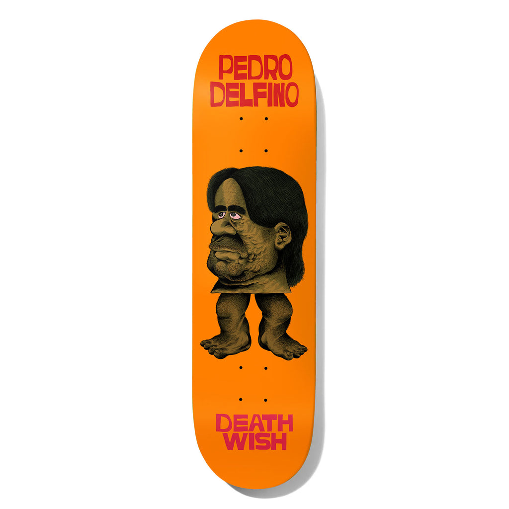 Deathwish Delfino Froelich 8.25 skateboard deck: A grotesque cartoon figure with a large, lumpy bearded face under long dark hair, standing on small hairy legs and bare feet, in brown and olive tones on a bright orange deck. The rider's name is at the top and Deathwish at the bottom, in red.
