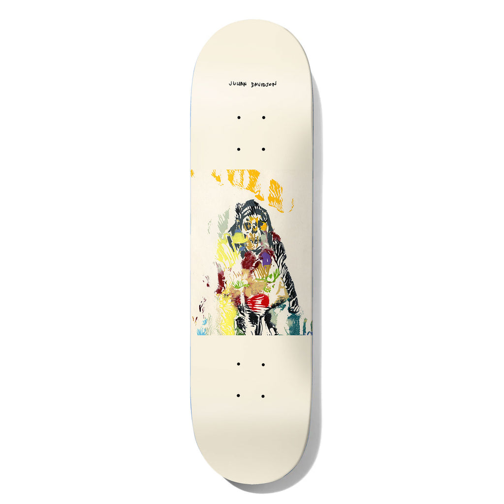 Deathwish Julian Am In Trouble 8.5 skateboard deck: Cream deck with a rough printmaking-style hooded figure with a skull face in black, yellow, red, green and blue scraps of colour, in a square block at the centre. Rider name handwritten at the top.