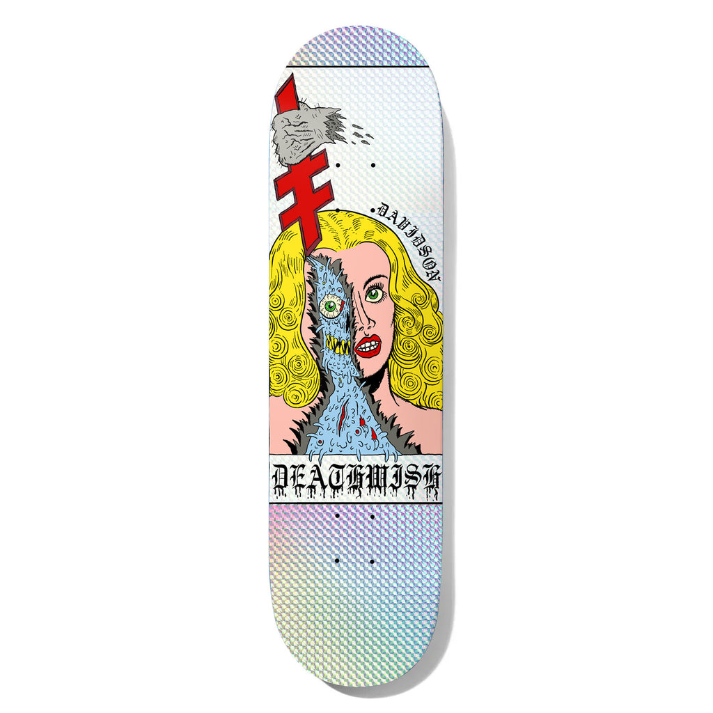 Deathwish Julian Fake Skin 8.0 skateboard deck: Cartoon blonde woman with one half of her face peeled away to reveal a blue monster with a staring eye and teeth, a stone being thrown at the red Deathwish logo above, on a holographic foil background.
