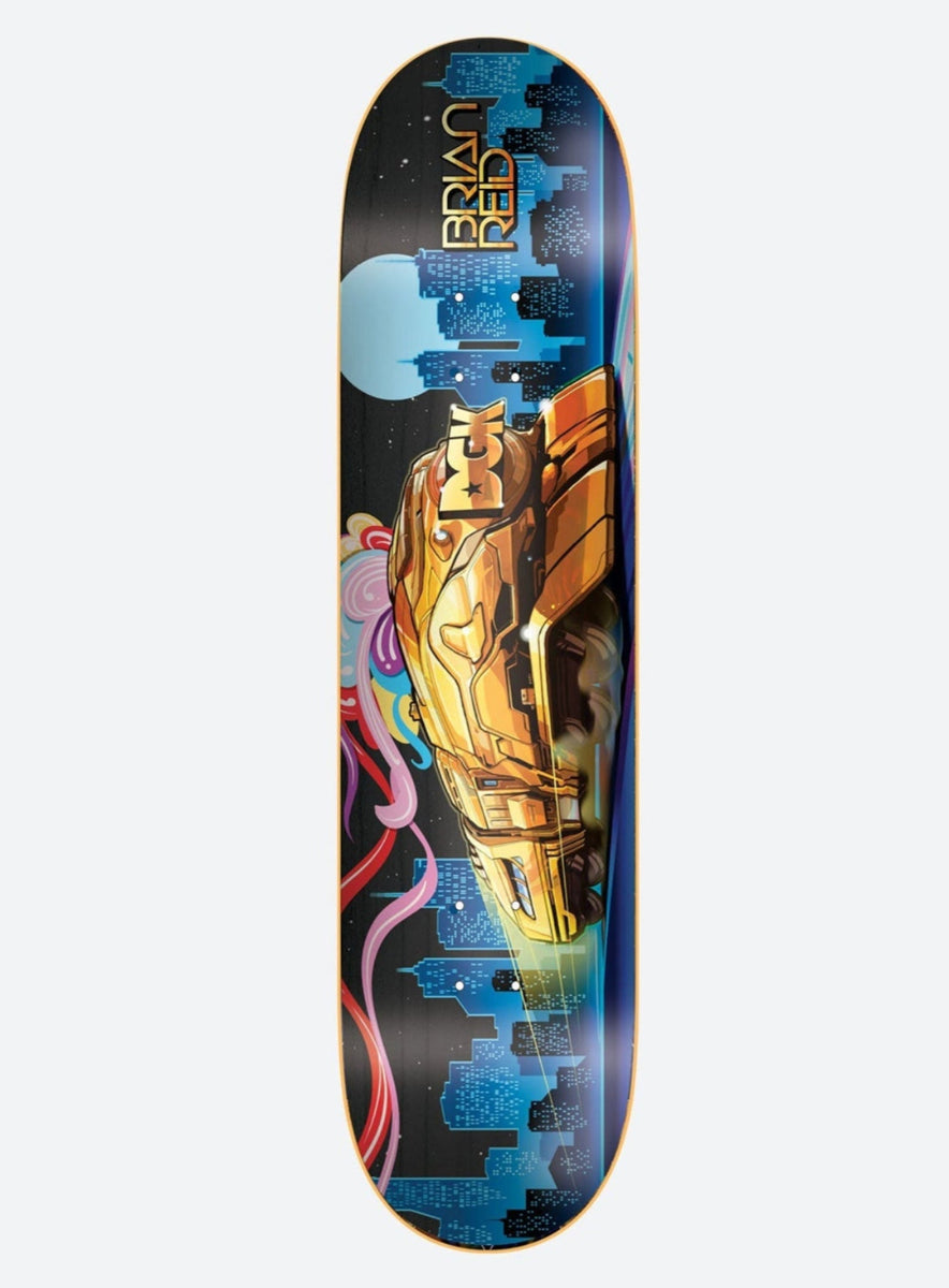 DGK All Aboard Reid 8.5 skateboard deck: A golden futuristic car speeds through a night city skyline of blue skyscrapers with a pale moon and swirling rainbow ribbons at the left. The name is at the nose.