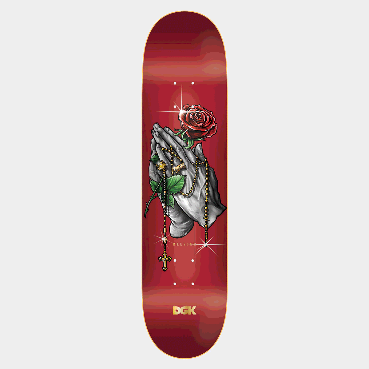 DGK Blessed Lenticular skateboard deck: Grey praying hands wrapped in a gold rosary with a cross, holding a red rose, with sparkle highlights on a red gradient deck. Small 'Blessed' text and a gold brand logo at the tail.