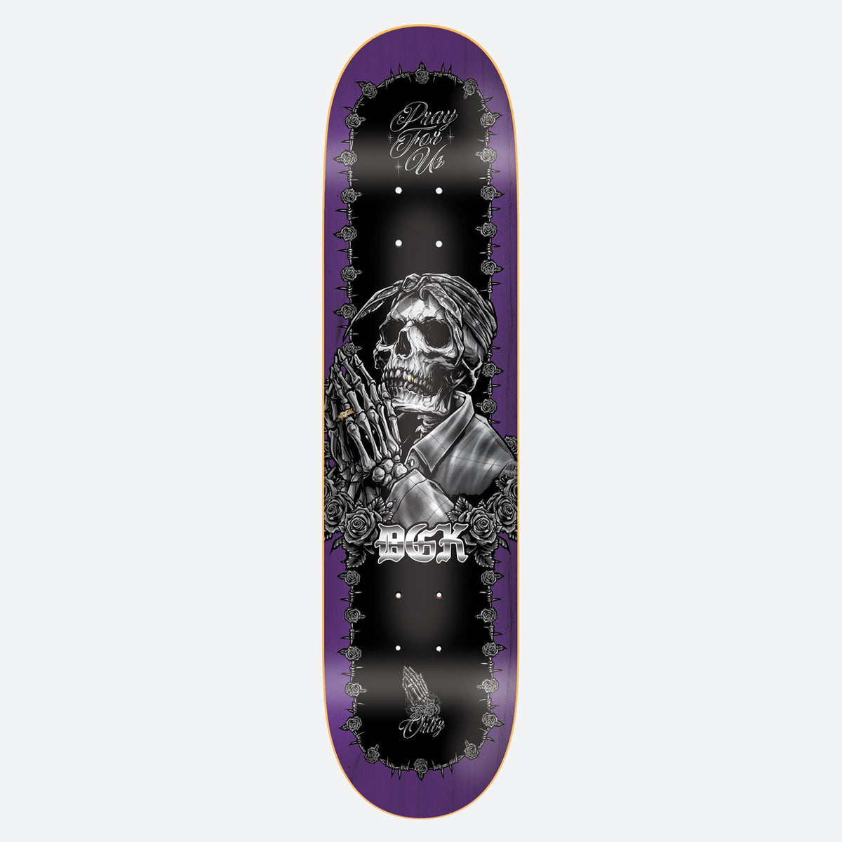 DGK Devoted Ortiz 8.25 skateboard deck: Monochrome illustration of a skeleton in a bandana and checked shirt with praying hands, framed by roses and thorns on a black panel over a purple-stained deck. DGK logo in chrome lettering beneath.