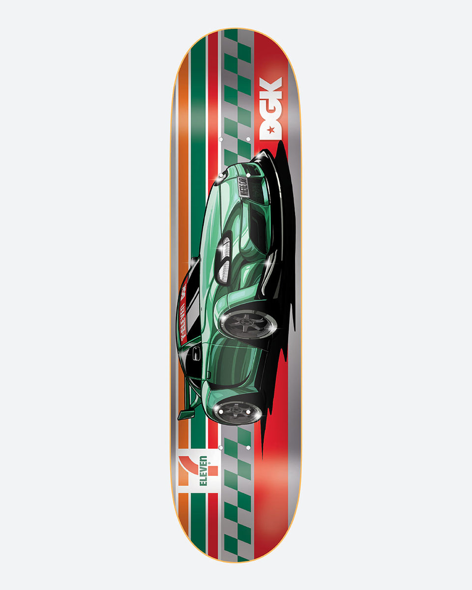 DGK x 7 - Eleven 8.25 skateboard deck: Green sports car seen from above, racing down the deck over 7-Eleven orange, green and red stripes with chequered edges and silver panels; white DGK logo at the top and 7-Eleven logo at the bottom.