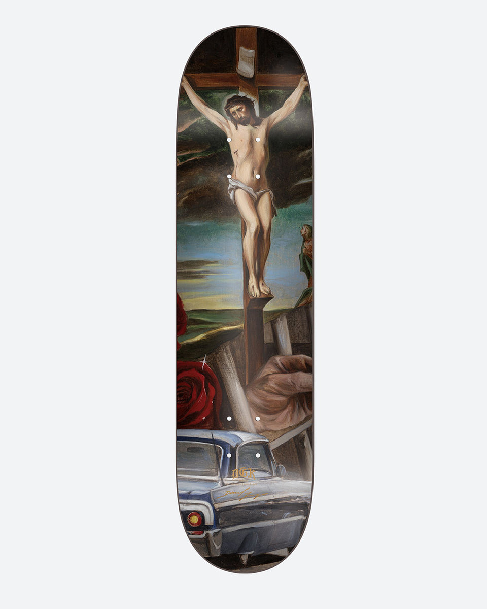 DGK Godffiti No.3 8.1 skateboard deck: Painted Renaissance-style crucifixion scene with Christ on the cross under a stormy sky, a red rose and a hand holding a nail at the bottom, and the front of a lowrider car at the tail.