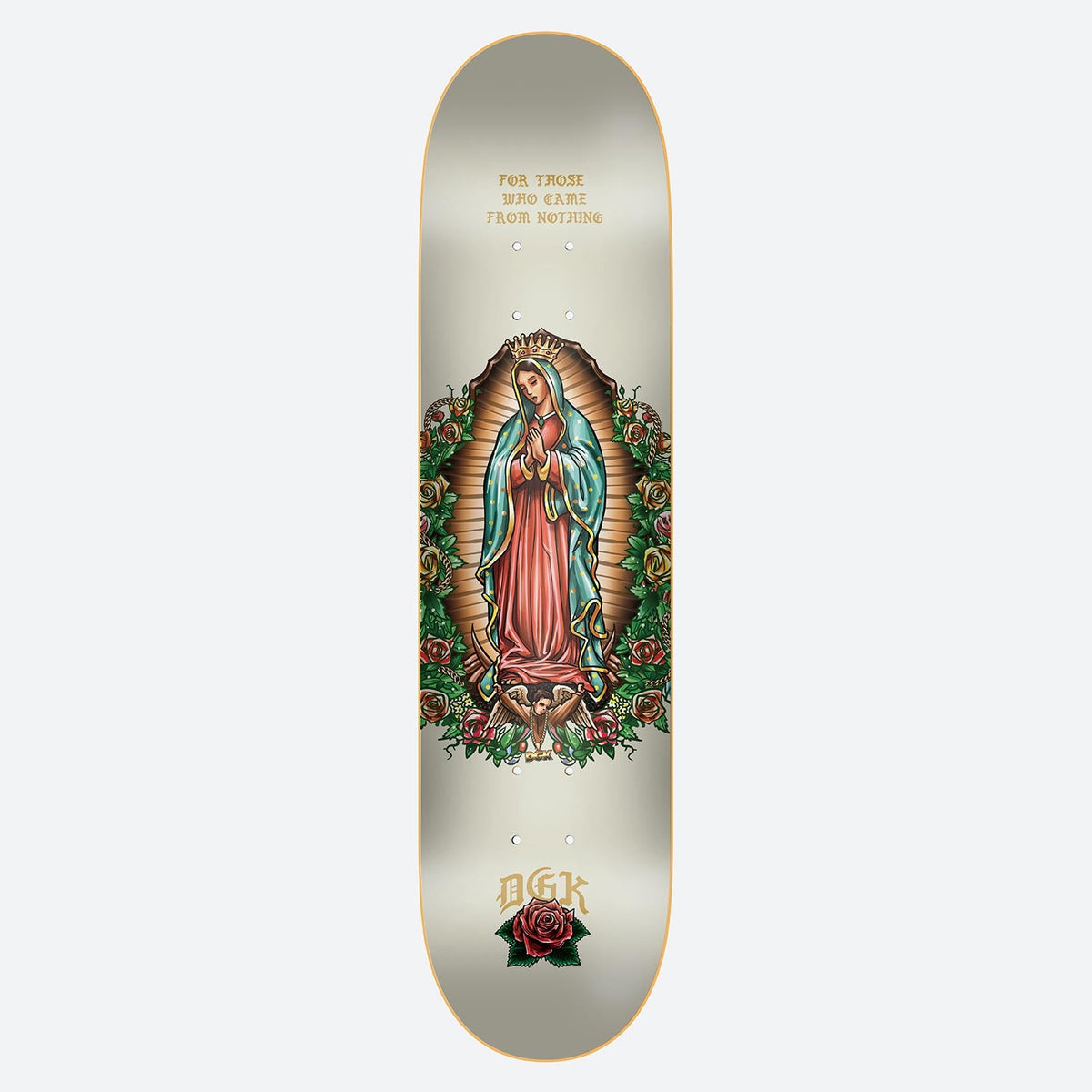 DGK Grace Cream 8.06 skateboard deck: Cream deck with a tattoo-style illustration of Our Lady of Guadalupe in a red robe and teal mantle, with golden rays, roses and a cherub at her feet. Gold blackletter text above and DGK with a red rose below.
