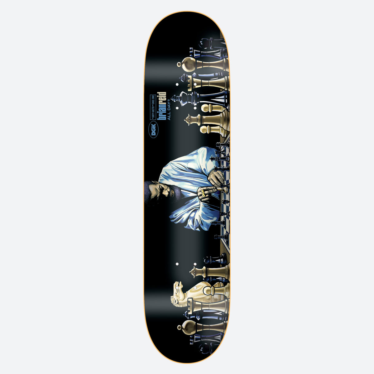 DGK Next Move Reid 8.25 skateboard deck: Man in a white shirt seated at a long chessboard, flanked by large gold and black chess pieces, on a black deck. DGK logo and brian reid ALL DAY text in blue near the top.
