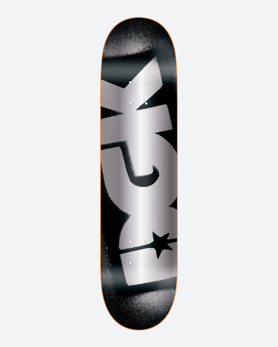 DGK OG Logo Foil skateboard deck: Large silver foil DGK letters with a star, spray-painted stencil style, sideways along a black deck with soft grey spray edges.