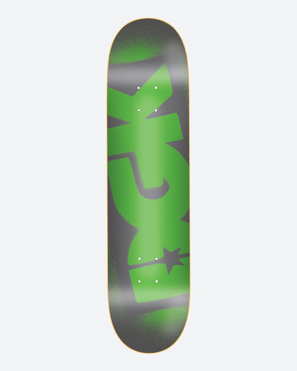 DGK OG Logo Green 8.25 skateboard deck: A very large green DGK logo with a star, sprayed over a grey deck with soft spray-paint edges, running the full length of the board.