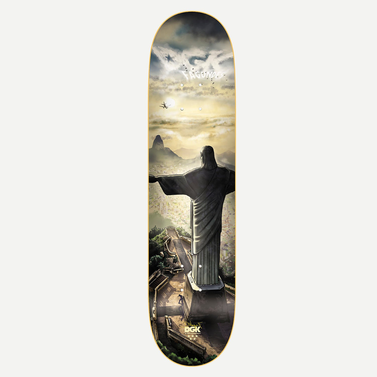 DGK Redeemer Fagundes 8.0 skateboard deck: Rear view of the Christ the Redeemer statue over Rio de Janeiro at sunrise, with Sugarloaf Mountain, hazy hills, a plane and a small skater on the steps below. Cloud lettering of DGK and the rider name sits at the top.