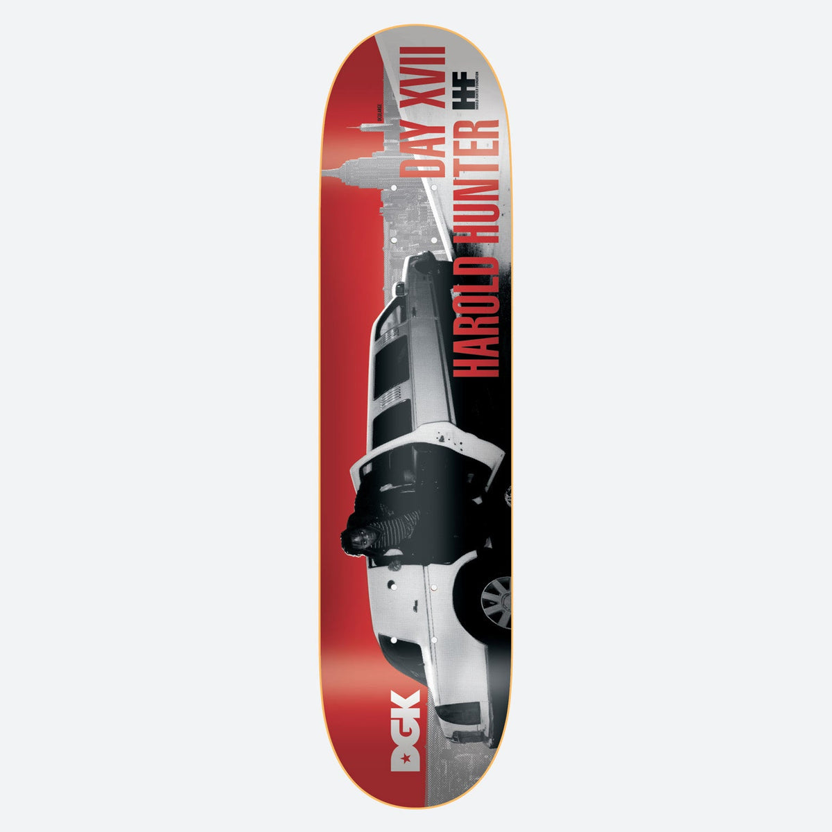 DGK Street Soldier Harold Hunter skateboard deck: Black and white photo of a long white limousine with a figure standing beside it, set against a New York skyline with the Empire State Building, on a red ground. Rider name and Roman numeral run up the board; DGK logo at the tail.
