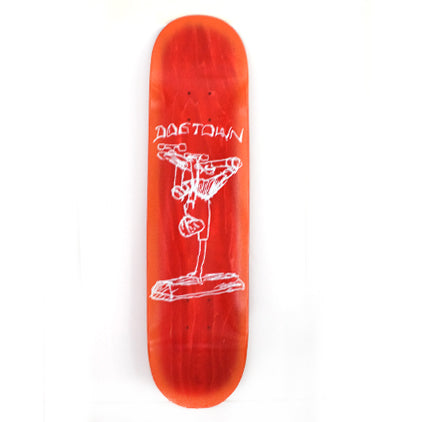 Dogtown Curb Plant - x skateboard deck: Red-stained deck with a rough white line drawing of a skater doing a handstand plant on a curb, with Dogtown in shaky lettering above.