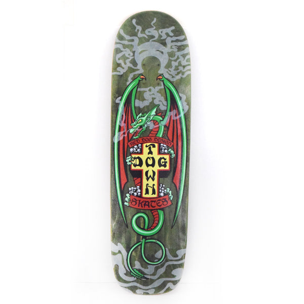 Dogtown Red Dog Smoking Dragon 9 x skateboard deck: Shaped deck with a green dragon with red wings coiled around the yellow Dogtown cross, with ribbon banners and small skulls, over grey swirling smoke on a dark green stain.