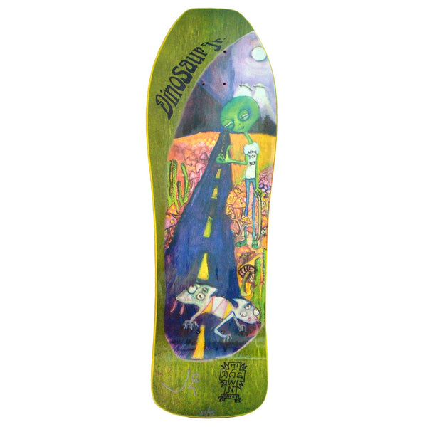 Dogtown Jims Corner - DINOSAUR JR X DOGTOWN - Released 2018 skateboard deck: Retro-shaped deck with a painted scene of a green alien in a t-shirt standing by a desert road, with a two-headed creature in the road and a moon above. Dinosaur Jr. is lettered at the top left, with a Dogtown cross logo and signature at the bottom.