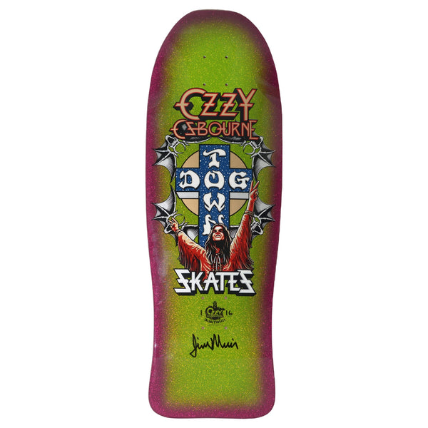 Dogtown Limited Dogtown Ozzy Osbourne - x - Gecko Green / Lavender Flake skateboard deck: Old-school shaped deck with a heavy-metal-style portrait of a long-haired figure with arms raised in front of the Dogtown cross, flanked by bat wings and chains. Ozzy Osbourne logo above, Skates below, with a signature at the bottom.