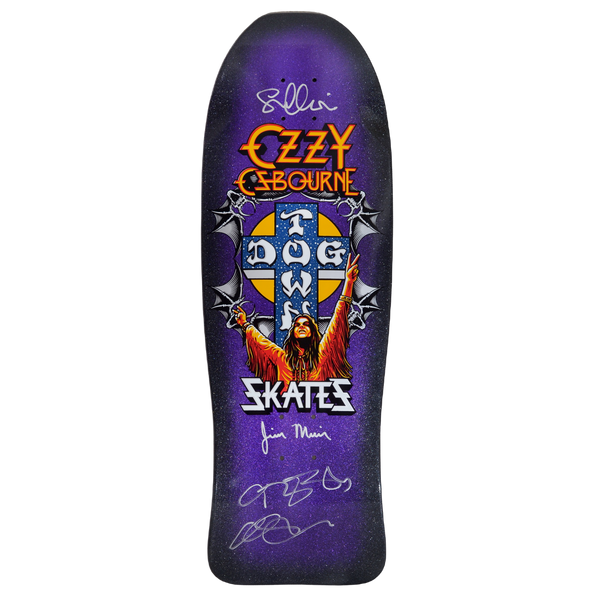 Dogtown Signed Limited Dogtown Ozzy Osbourne - x - Purple Flake / Black Fade skateboard deck: Rock singer with arms raised in peace signs beneath the Dogtown cross logo, framed by winged bat-like ornaments, with Ozzy Osbourne logo above and Skates below, on a purple flake black fade old-school shape covered in silver signatures.