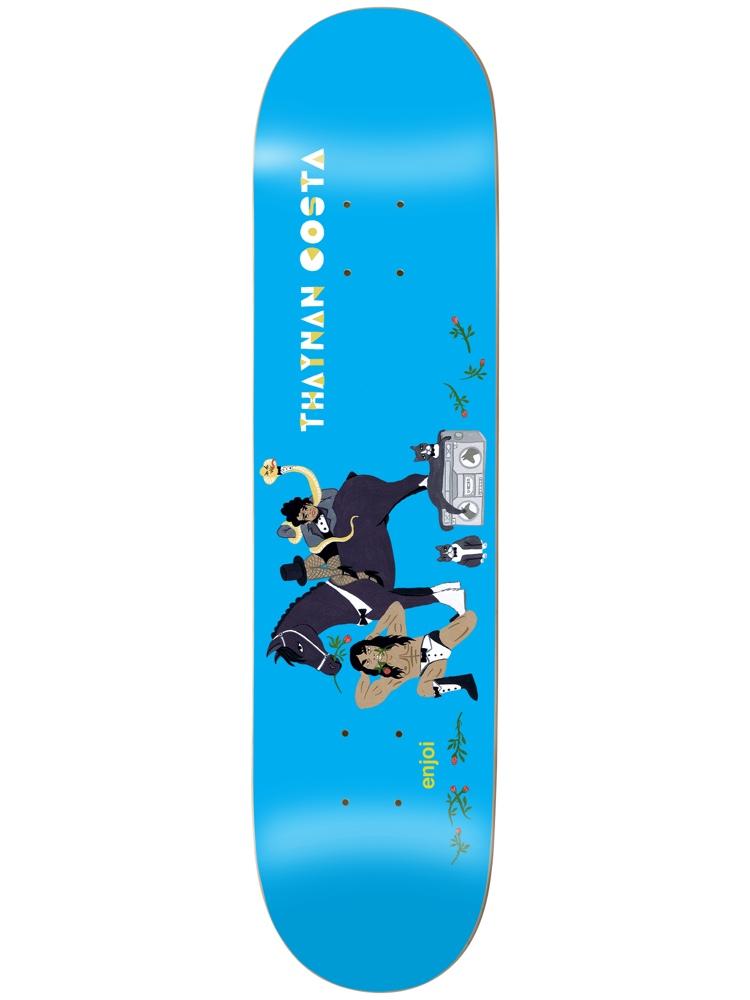Enjoi thaynan over board impact light skateboard deck: Flat illustration on a bright blue deck of a figure in dark clothing riding a black horse and holding a snake, a muscular man in boots lying below, a boombox, two small dogs and rose stems. Rider name runs vertically.