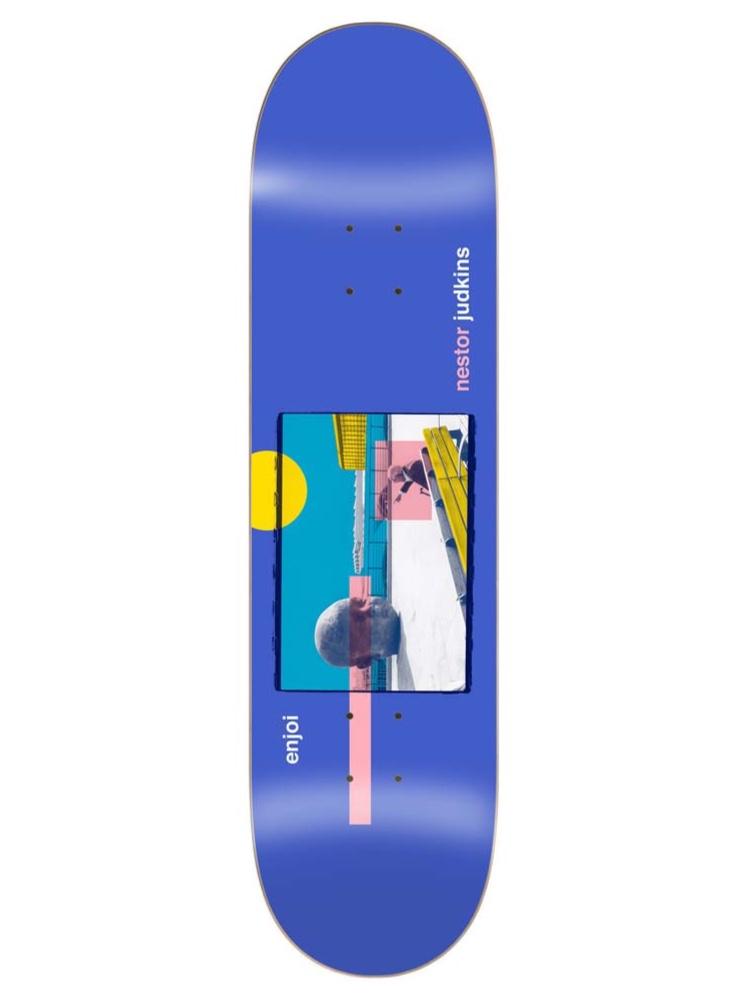 Enjoi judkins skart skateboard deck: Framed collage-style photo on a blue deck showing a skater on a rail beside a stone bust, with a yellow sun circle and a pink bar. Nestor Judkins and enjoi are printed in small type.