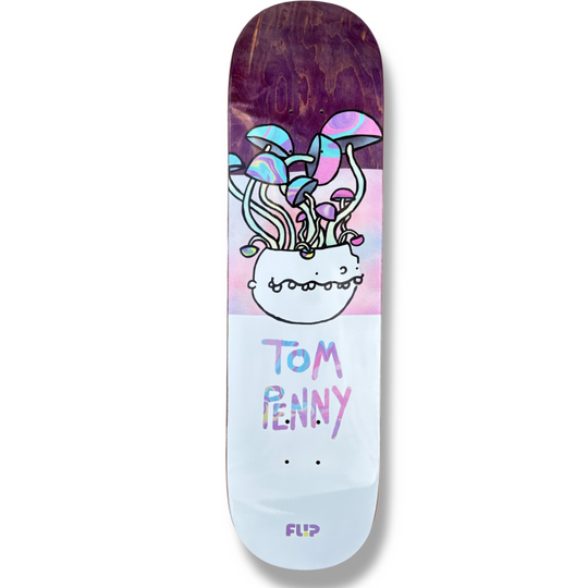 Flip Tom Penny Buddies 31.75 skateboard deck: Cartoon-style white bowl with a toothy grin sprouting long-stemmed psychedelic mushrooms with iridescent caps, over a pink and lilac gradient. Rider name in wobbly iridescent hand lettering on a pale lower half; purple stained wood at the top.