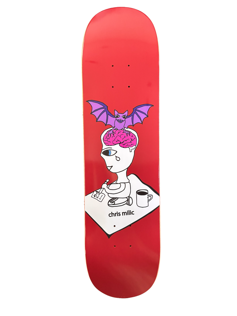 Frog Bat Brain (Chris Milic) skateboard deck: A cartoon one-eyed crying figure with an exposed pink brain, topped by a purple bat, writes on a paper beside a coffee mug and pills, on a red deck with the rider name below.