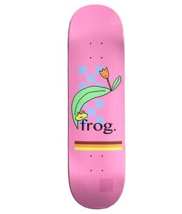 Frog Flower 8.5 skateboard deck: A small green frog peeking out from beneath a large green leaf, with an orange tulip, over blue checks on a pink deck. Black lowercase Frog text and a brown, red and yellow stripe sit below.