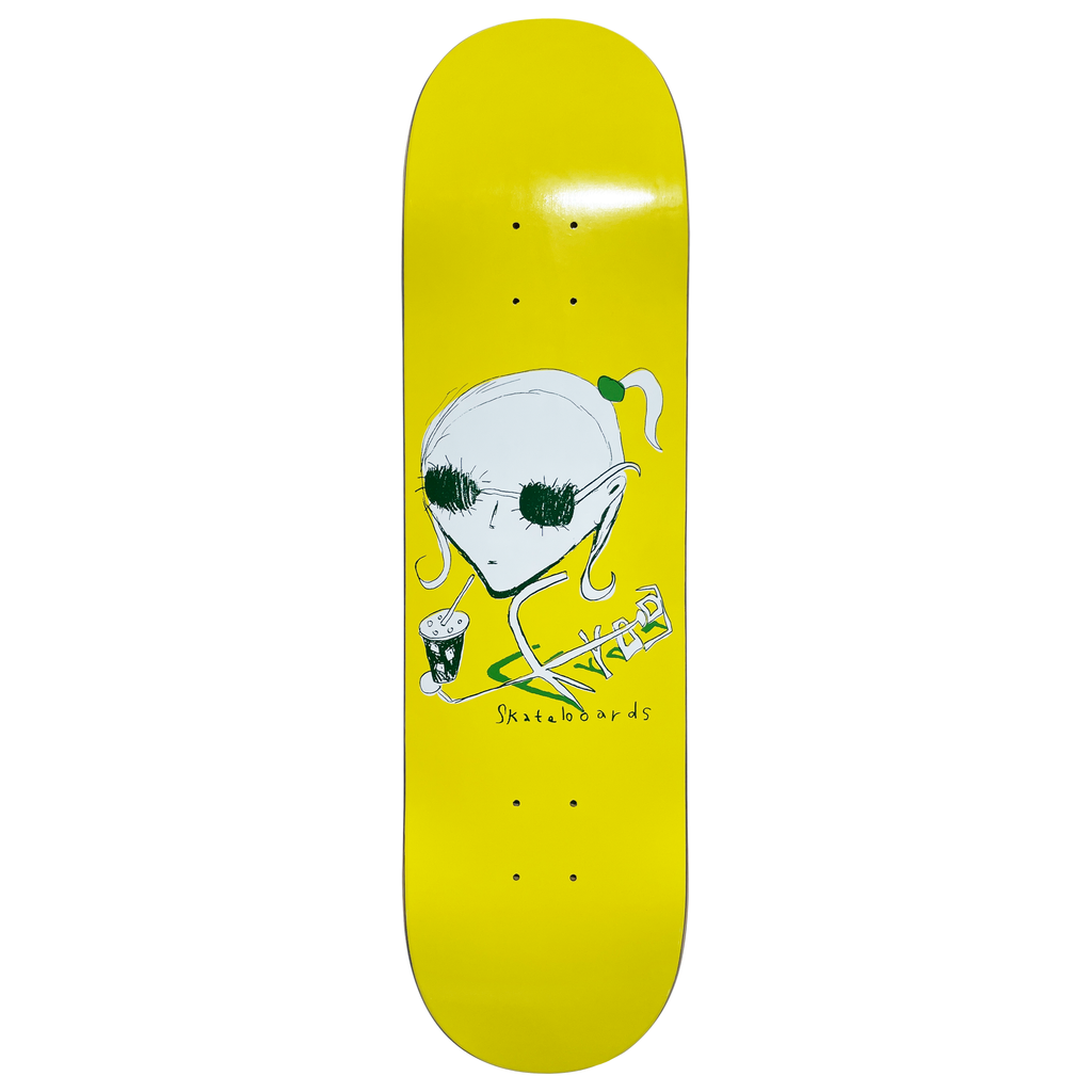 Frog Iced Coffee Girl skateboard deck: Scribbled pale alien girl with a ponytail and dark sunglasses holding a cup with a straw, with a green skateboard doodle and handwritten 'Skateboards', on a bright yellow deck.
