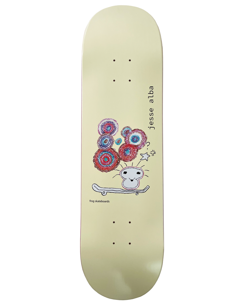 Frog Jess Alba 8.6 skateboard deck: A childlike crayon drawing of a small character with spiky hair on a skateboard, with a cluster of red, blue and purple scribbled circles above its head and a star. Pale yellow deck with jesse alba printed vertically.