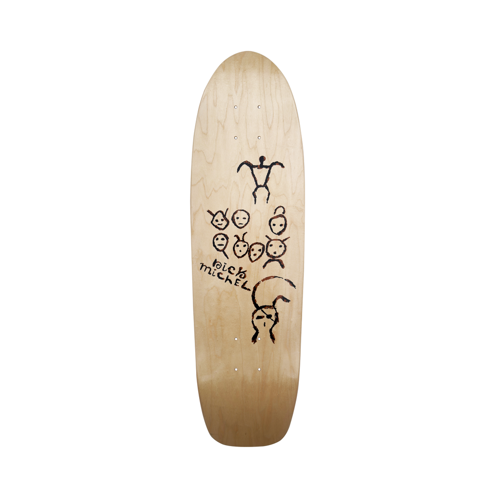 Frog Petroglyphs (Nick Michel) skateboard deck: Natural wood old-school shaped deck with rough black and brown petroglyph-style drawings of a stick figure, a group of small faces and a curled creature with a face. 'Nick Michel' is handwritten in the middle.