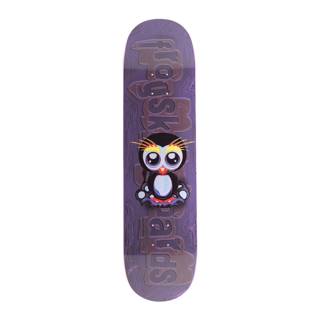 Frog Secret Penguin (Frankie Decker) skateboard deck: Large-eyed cartoon penguin with yellow crest feathers, sitting centrally over a big faded 'frog skateboards' logo on a purple swirled background.