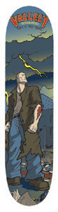 Vallely Mike V. Pro Hero skateboard deck: Comic-book style illustration of a tall, stitched Frankenstein-like man in a long coat standing under a stormy sky with a yellow lightning bolt, beside a town scene. Red Vallely logo lettering at the top.