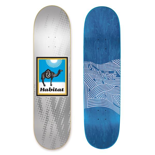 Habitat Camel Logo Sm skateboard deck: A silver deck with a halftone dot pattern, with a framed blue desert scene of a black camel with a logo on its hump under a sun burst, above the Habitat name. Beside it the underside shows white wavy line-work on blue.