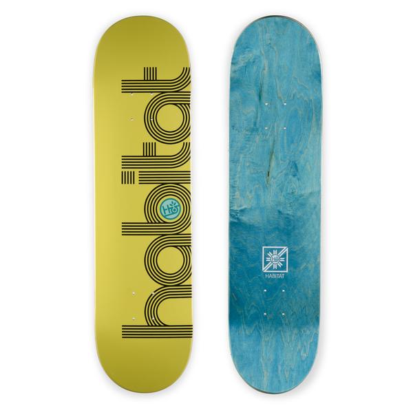 Habitat Ellipse Md skateboard deck: Large black multi-line outlined Habitat wordmark running the length of a mustard-yellow deck, with a small teal logo roundel in the 'a'. The bottom of the deck is blue-stained wood with a small logo.