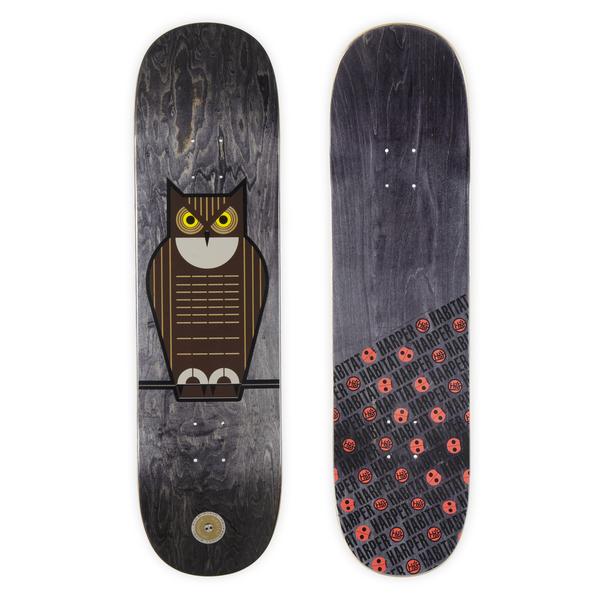 Habitat Harper Owl Flo skateboard deck: Stylised geometric great horned owl with yellow eyes perched on a branch, on a grey-black stained deck. The underside shows a repeating Habitat Harper logo and red skull pattern.