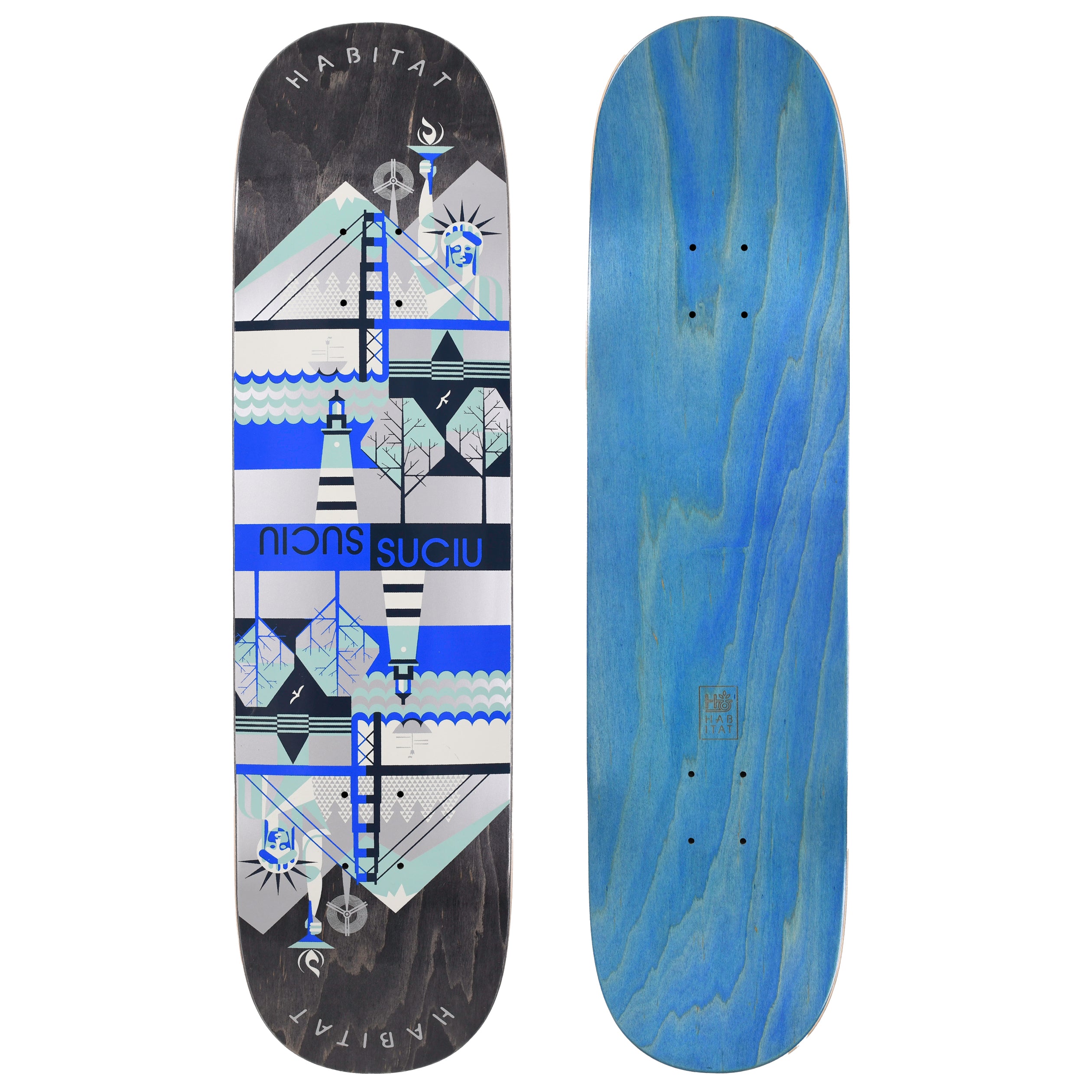 Habitat Suciu Twin Continental skateboard deck: A mirrored, geometric design of landmarks including the Statue of Liberty, a suspension bridge, a lighthouse and trees, in blue, grey and silver bands on a black-stained deck. 'Suciu' appears twice, once reversed, with Habitat curved at both ends. The photo also shows the blue underside.