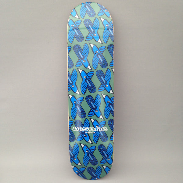 Insane Stanley Bird skateboard deck: Repeating all-over pattern of stylised blue birds, each with a skateboard-shaped body and white beak, set on a muted green background. The Insane logo and a small name sit near the tail.