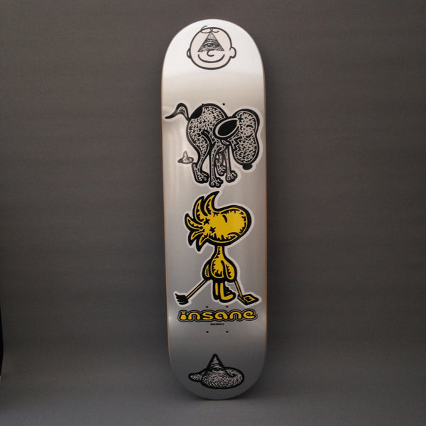 Insane Snooper Scooper skateboard deck: Silver deck with a stack of cartoon characters: a round face with an eye-in-pyramid, a scruffy black-and-white dog, a yellow bird holding a hockey stick, and a pyramid-eye mark at the tail, above the Insane logo.