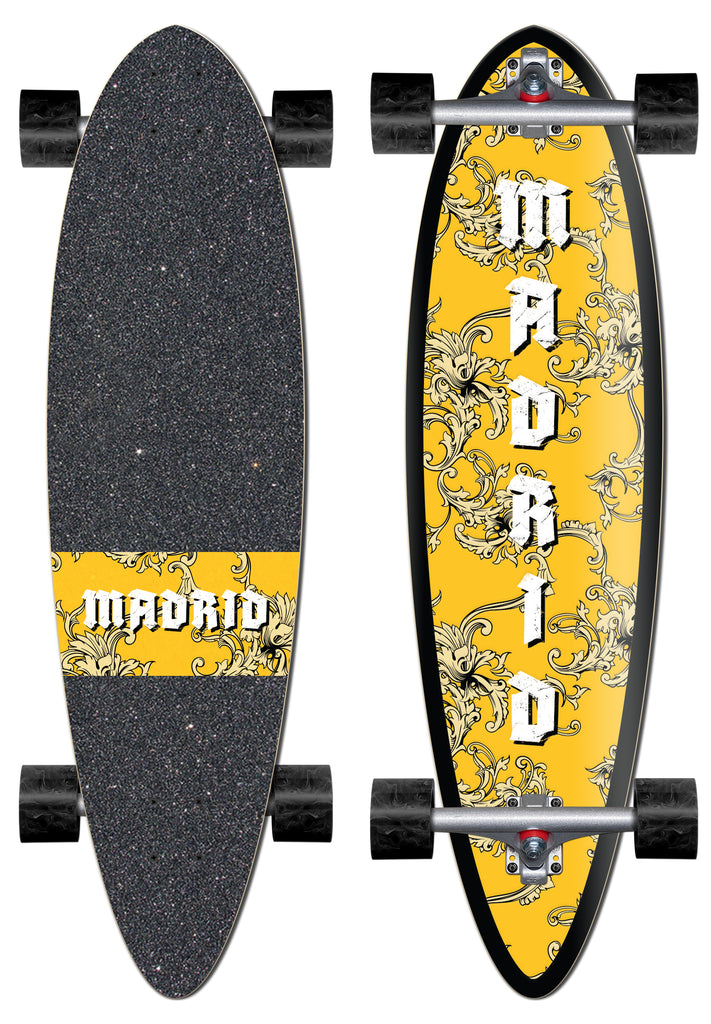 Madrid Blunt 36 skateboard deck: Pintail longboard shown top and bottom. The underside has a yellow field covered in cream baroque scrollwork with 'MADRID' in white gothic lettering running down it; the griptape has a matching yellow band.