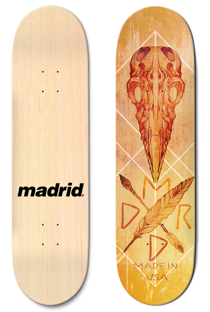 Madrid Crow 8 skateboard deck: Orange-toned drawing of a bird skull above a crossed feather and arrow, with diamond line patterns behind, on a yellow-orange distressed background. Photo shows the plain natural bottom with a Madrid logo too.